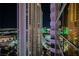 Striking night view of the city skyline from a high-rise building with bright, illuminated buildings at 135 Harmon Ave # 3220, Las Vegas, NV 89109