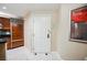 View of the hallway with art and a door next to the kitchen, creating a welcoming space at 135 Harmon Ave # 3220, Las Vegas, NV 89109