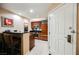 Cozy kitchen featuring a breakfast bar, stainless steel appliances, and sleek black countertops at 135 Harmon Ave # 3220, Las Vegas, NV 89109