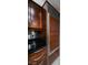 Contemporary kitchen featuring a stainless steel refrigerator, dark countertop, and elegant cabinetry at 135 Harmon Ave # 3220, Las Vegas, NV 89109