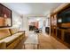 Cozy living room with view to kitchen, including sofa, tv cabinet, and ample lighting at 135 Harmon Ave # 3220, Las Vegas, NV 89109