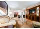 Spacious living room with view to kitchen, complete with sofa, tv cabinet, and stylish decor at 135 Harmon Ave # 3220, Las Vegas, NV 89109