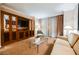 Bright living room featuring sofa, tv cabinet, and well designed curtains at 135 Harmon Ave # 3220, Las Vegas, NV 89109