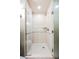 Bright, tiled shower with a glass door and built in shower caddy for all your bathroom essentials at 135 Harmon Ave # 3220, Las Vegas, NV 89109