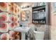 Bathroom with a sink, toilet, and patterned shower curtain, providing essential amenities at 1701 Linden Ave, Las Vegas, NV 89101