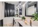 Charming bathroom features white vanity, stylish decor, and a well-lit mirror at 1701 Linden Ave, Las Vegas, NV 89101