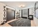 Modern bedroom with stylish decor, a large rug and a cozy reading chair at 1701 Linden Ave, Las Vegas, NV 89101