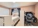 Bedroom featuring a bed, desk, and chair, providing a functional and private space at 1701 Linden Ave, Las Vegas, NV 89101