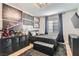 Comfortable bedroom featuring stylish decor, a flat-screen TV, and a window at 1701 Linden Ave, Las Vegas, NV 89101