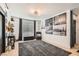 Bright bedroom with modern decor, gray accents, and a comfortable seating area at 1701 Linden Ave, Las Vegas, NV 89101