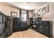 Organized bedroom or flex space with black cube storage units, light wood floors, and decorative wall art at 1701 Linden Ave, Las Vegas, NV 89101