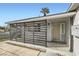 Inviting front porch featuring horizontally slatted privacy enclosure and a secure screen door at 1701 Linden Ave, Las Vegas, NV 89101