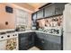 A fully equipped kitchen with dark cabinets, a sink, and basic appliances at 1701 Linden Ave, Las Vegas, NV 89101