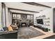 Cozy living room featuring a stone fireplace, dark wood beams, and wall decor at 1701 Linden Ave, Las Vegas, NV 89101