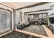 Charming living room with a stone fireplace, wood beam ceiling, and leather seating for a cozy atmosphere at 1701 Linden Ave, Las Vegas, NV 89101