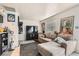 Cozy living room featuring a large sectional sofa, TV, and decorative wall art at 1701 Linden Ave, Las Vegas, NV 89101