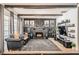 Charming living room featuring a stone fireplace, dark wood beams, and leather seating for a cozy atmosphere at 1701 Linden Ave, Las Vegas, NV 89101