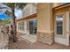 Backyard with patio, barbecue, privacy wall and desert landscaping with rocks at 228 Lorryn Ln # 2, Boulder City, NV 89005