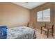 Bedroom featuring neutral paint, carpet flooring, and natural light at 228 Lorryn Ln # 2, Boulder City, NV 89005