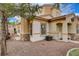 Charming home exterior with desert landscaping, stone accents and covered front porch at 228 Lorryn Ln # 2, Boulder City, NV 89005