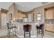 Kitchenette with bar seating, cabinets, and sleek countertops at 228 Lorryn Ln # 2, Boulder City, NV 89005