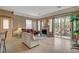 Comfortable living room with backyard access, fireplace, and neutral tones at 228 Lorryn Ln # 2, Boulder City, NV 89005