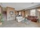 Open-concept living area featuring stairs, tile flooring, and bar seating at 228 Lorryn Ln # 2, Boulder City, NV 89005