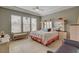 Spacious main bedroom features tray ceilings, neutral paint and large windows at 228 Lorryn Ln # 2, Boulder City, NV 89005