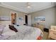 Bright and airy main bedroom featuring a large bed, tile flooring and ample natural light at 228 Lorryn Ln # 2, Boulder City, NV 89005