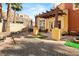 Private backyard featuring a stone wall, pergola, and an outdoor seating area, ideal for entertaining at 23 Cerchio Basso, Henderson, NV 89011