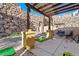 Outdoor area with pergola, stone wall, and seating for outdoor gatherings and relaxation at 23 Cerchio Basso, Henderson, NV 89011