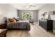 Bright bedroom with colorful pillows, side tables and backyard views through the window at 23 Cerchio Basso, Henderson, NV 89011