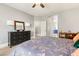 Well-lit bedroom with wood floors and large dresser at 23 Cerchio Basso, Henderson, NV 89011