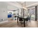 Bright dining area with stylish chandelier and a seamless flow into the well-equipped kitchen at 23 Cerchio Basso, Henderson, NV 89011