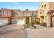 Charming two-story townhome featuring a well-maintained front yard and attached two-car garage at 23 Cerchio Basso, Henderson, NV 89011