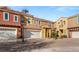Charming two-story townhome featuring a well-maintained front yard and attached two-car garage at 23 Cerchio Basso, Henderson, NV 89011