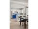 Modern kitchen featuring white cabinets, stainless steel appliances, and breakfast bar at 23 Cerchio Basso, Henderson, NV 89011