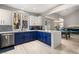 Open-concept kitchen with peninsula, white countertops, and dining area at 23 Cerchio Basso, Henderson, NV 89011