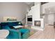 Bright living room with fireplace, plush seating, and soaring ceilings at 23 Cerchio Basso, Henderson, NV 89011