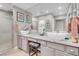 Modern bathroom featuring double sinks with granite countertops and a glass door shower at 2508 Palmridge Dr, Las Vegas, NV 89134