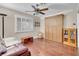 Bedroom with hardwood floors, large window, and a built in cabinet at 2508 Palmridge Dr, Las Vegas, NV 89134