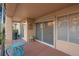 Cozy covered patio with sliding glass doors, ideal for relaxation and entertaining at 2508 Palmridge Dr, Las Vegas, NV 89134