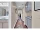 Hallway featuring a long colorful rug with storage space, bathroom sink in view at 2508 Palmridge Dr, Las Vegas, NV 89134