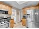 Bright kitchen featuring stainless steel appliances and tile flooring at 2508 Palmridge Dr, Las Vegas, NV 89134