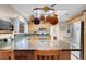 Well-lit kitchen featuring a breakfast bar, stainless steel appliances, and a skylight at 2508 Palmridge Dr, Las Vegas, NV 89134