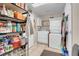 Functional laundry room with stacked washer/dryer and shelving for ample storage space at 2508 Palmridge Dr, Las Vegas, NV 89134