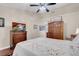 This is a very large main bedroom with hardwood floors, ceiling fan, and television at 2508 Palmridge Dr, Las Vegas, NV 89134