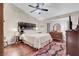 Comfortable main bedroom with a ceiling fan, hardwood floors, and a decorative rug at 2508 Palmridge Dr, Las Vegas, NV 89134