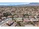 Scenic aerial view of a suburban neighborhood highlighting the well-spaced homes, with mountain views in the backdrop at 2608 Saltbush Dr, Las Vegas, NV 89134