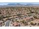 A panoramic aerial view captures a large community with mountain views, highlighting the neighborhood's layout and beauty at 2608 Saltbush Dr, Las Vegas, NV 89134